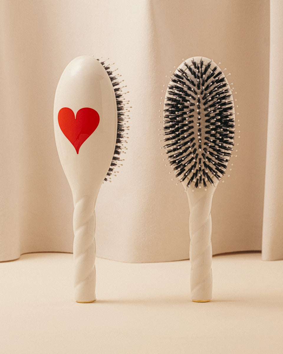 Trio: La Bonne Brosse, its comb, and its Limited Edition Queen of Hearts pouch