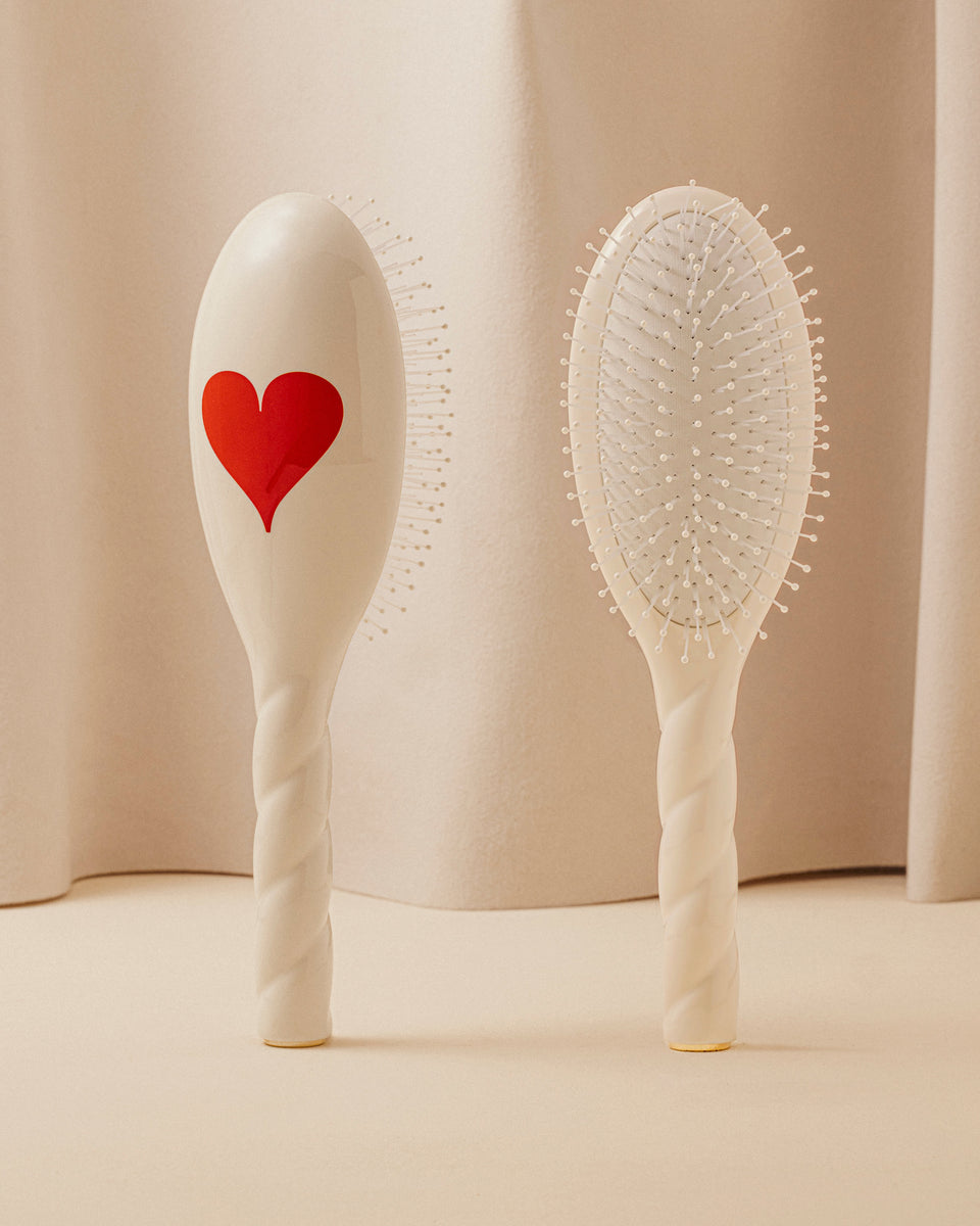 Trio: La Bonne Brosse, its comb, and its Limited Edition Queen of Hearts pouch