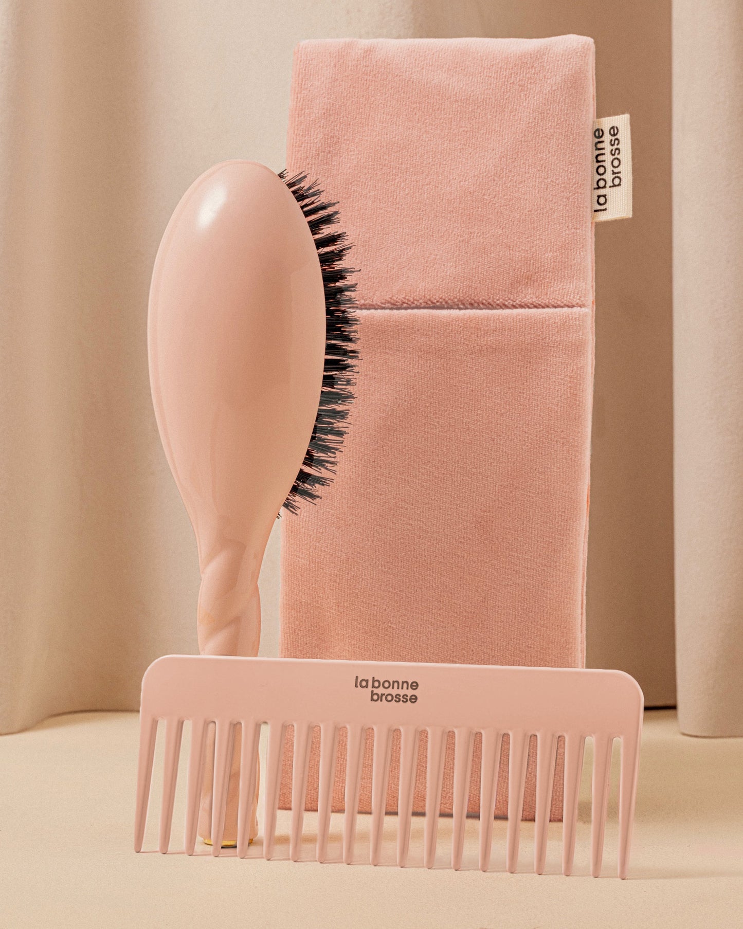 Trio: The Hairbrush, its Comb and its Powder Pink Pouch